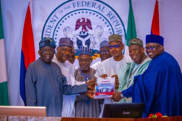 Tinubu, left,Ganduje , 2nd right and others with the report on the conference of Livestock Reforms