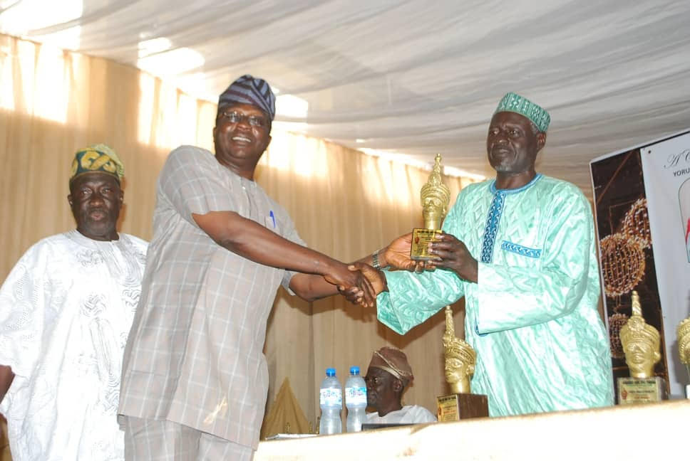 An awardee of Odu'a Awards being presented with award for his contribution to national growth