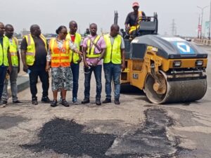 Federal Controller of Works in Lagos, Mrs Olukorede Kesha (middle) during an on-the-spot assessment of repairs on the Third Mainland Bridge on Sunday in Lagos.