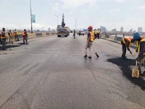 Workmen on the Third Mainland Bridge on Sunday in Lagos.