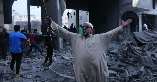 A man gives up inside the hit Ahli Arab Hospital in Gaza