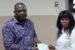 Adeyemi presenting cheque to one of the beneficiaries