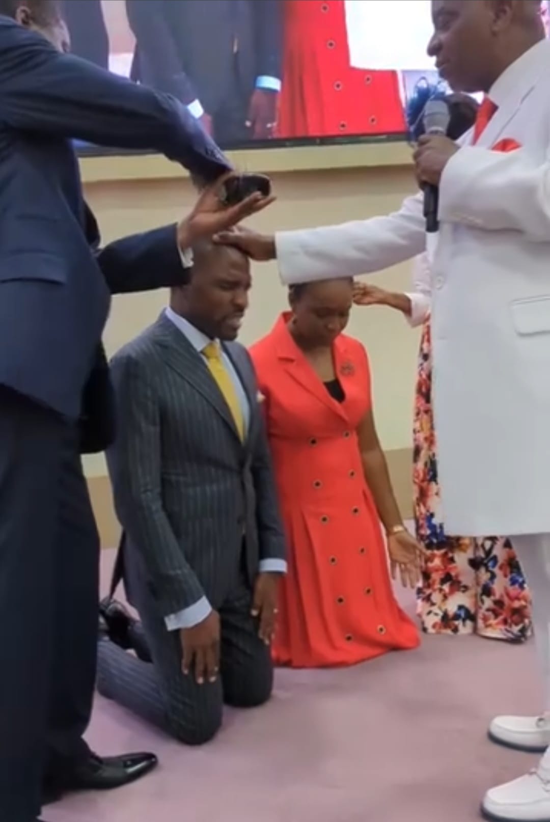 Bishop Oyedepo and Bishop Abioye anointing Isaac and his wife