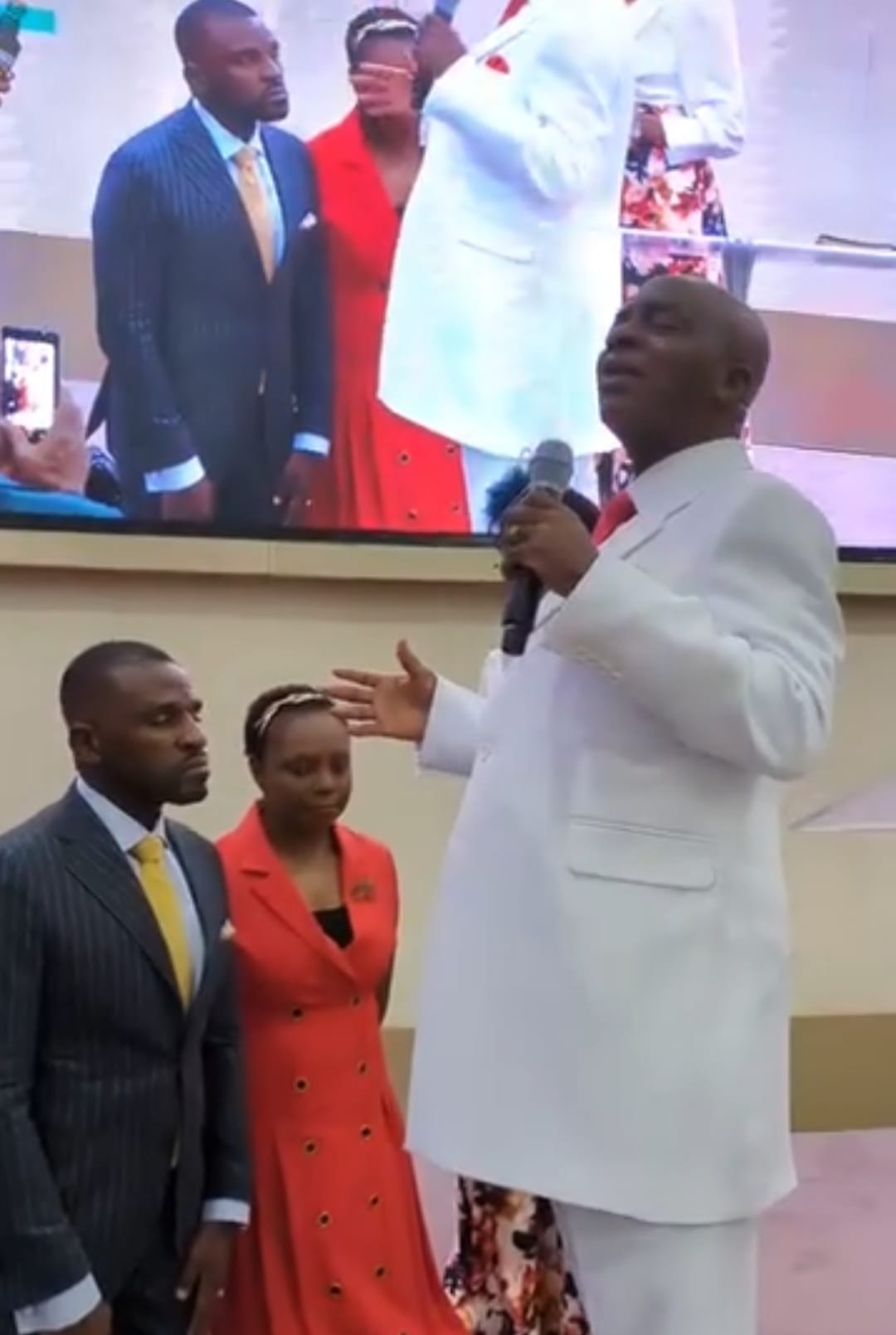 Bishop Oyedepo and Bishop Abioye anointing Isaac and his wife