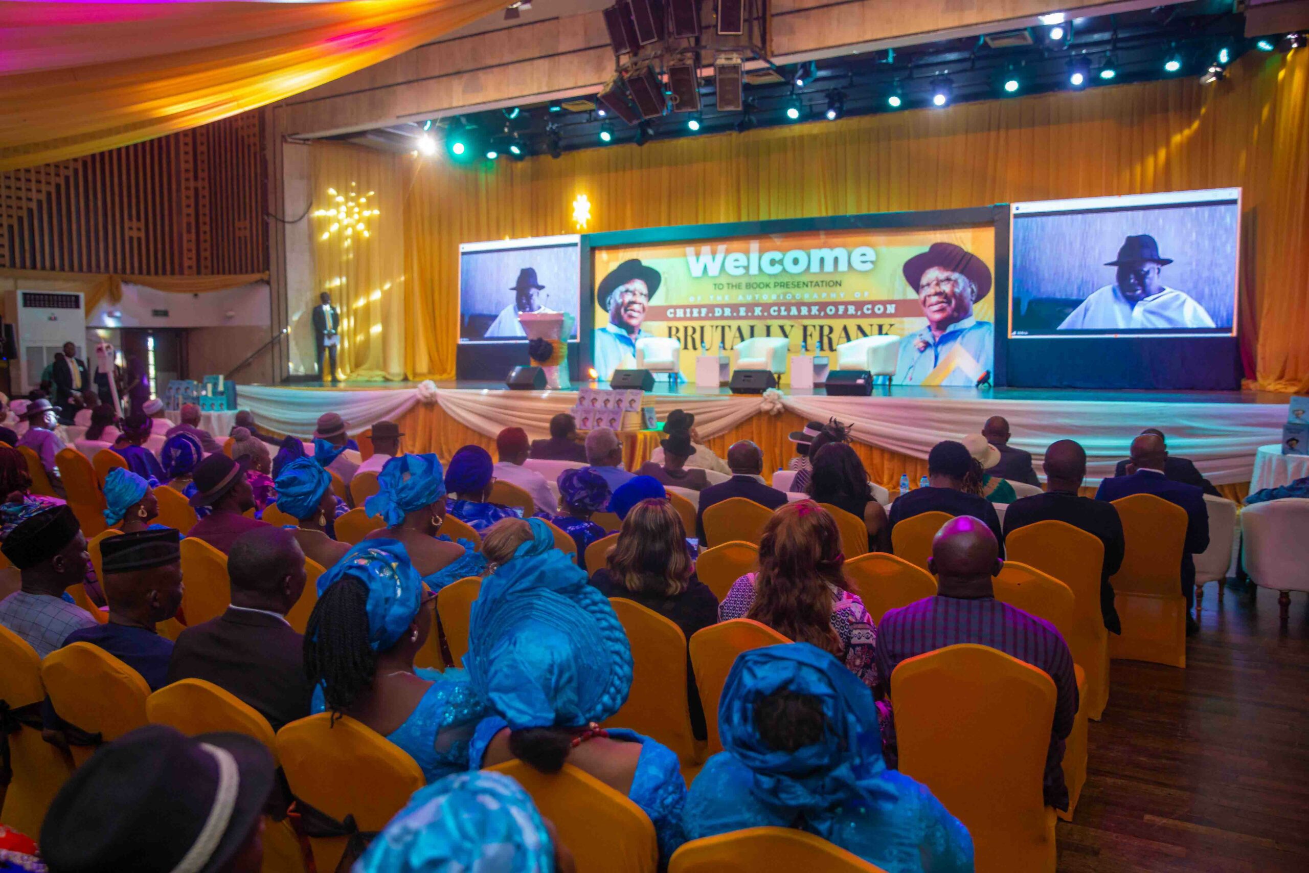 Chief JP Clark on the screen addressing the guests at the book launch in Lagos