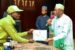 One of the Corps members receiving his certificate from Governor Namadi