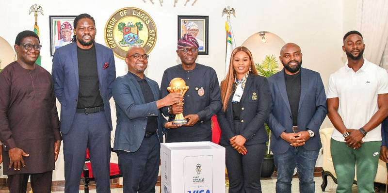 l-r: Director General, Lagos State Sports Commission (LSSC), Mr Gafaar Oluwatoyin; Director, Corporate Communications, VISA West Africa, Niyi Adebiyi; Vice President, Cluster Country Manager, Mr Andrew Uaboi; Gov. Babajide Sanwo-Olu of Lagos State; Marketing Director, VISA West Africa, Oluwaseun Adaramola; Director, Government Engagement, VISA West Africa, Chidozie Arinze and Commissioner for Youth and Social Development, Mr Mobolaji Ogunlende during an official presentation ceremony of the Africa Cup of Nations (AFCON) Trophy to the Governor by VISA (Title Sponsor of AFCON), at the Lagos House, Marina, on Thursday, Dec. 14, 2023.