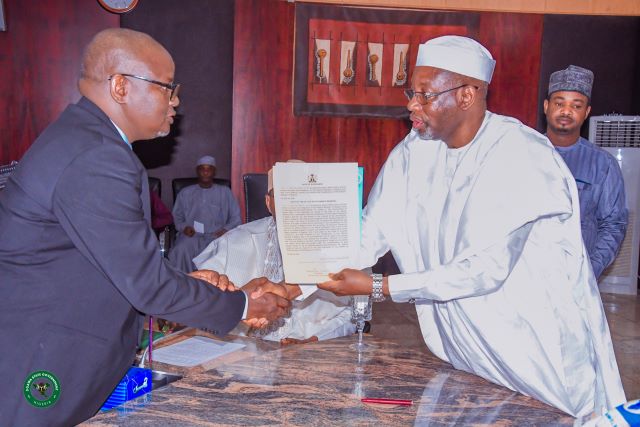 Governor Namadi swearing-in Bar. Fanini as the new Commissioner of Justice and Attorney-General of Jigawa State at the Council Chamber, Jigawa state Government House on Wednesday