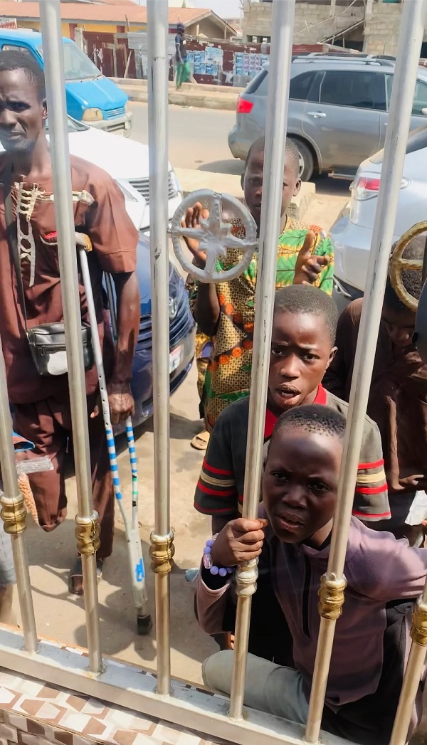 In the bustling streets of Osogbo, a trio of young boys, aged between 11 and 14, captivates passers-by with spontaneous singing performances.