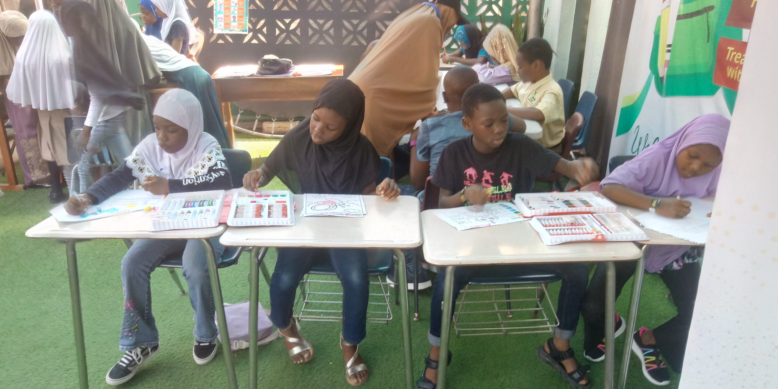 Participating children at the ARTISTIC AVENUE of the B bight kids STEAM Expo 2023 held in Surulere, Lagos, giving colourful effects to drawings.