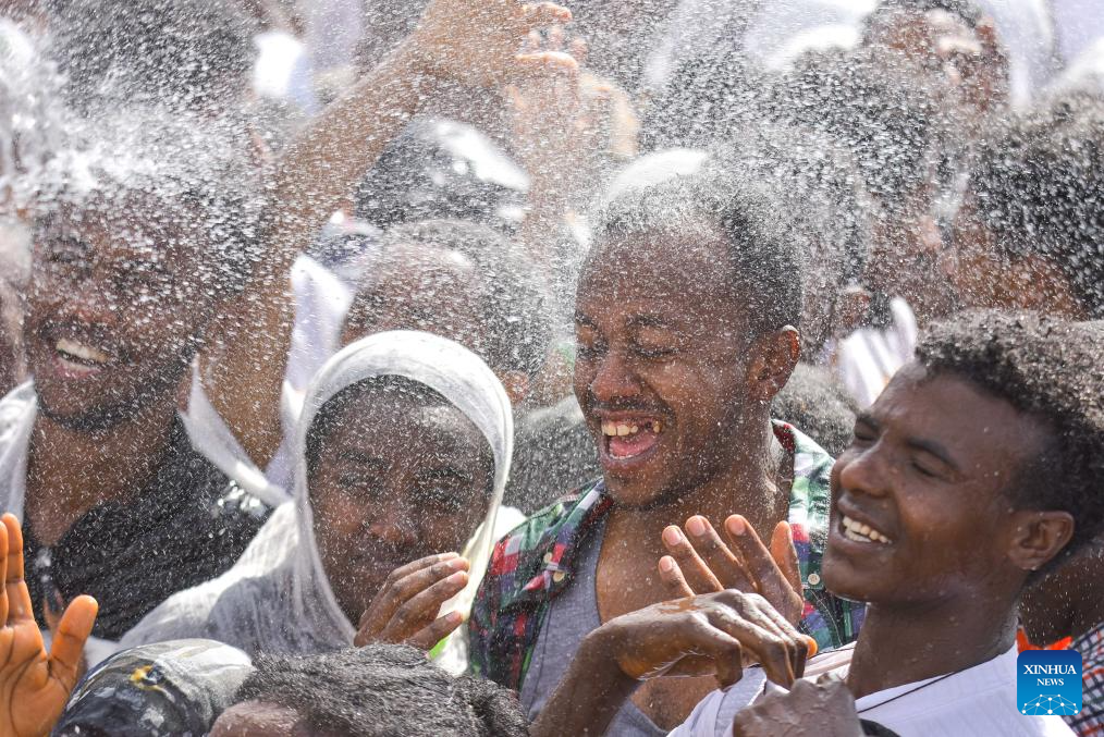 Holy water is sprinkled onto the crowds during Timket, the annual Ethiopian Epiphany festival, in Addis Ababa, the capital of Ethiopia, Jan. 20, 2024 (Xinhua/Michael Tewelde)