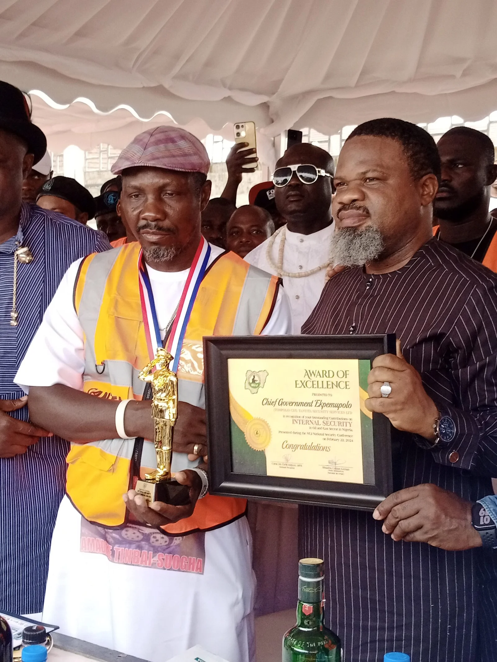 Tompolo (left) being presented with the 'Internal Security Meritorious Award' by the NUJ President Chris Isiguzo on Saturday in Delta