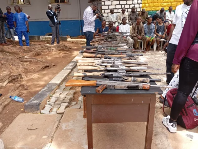 Some of the suspects and the weapons recovered from them by the police in Kaduna