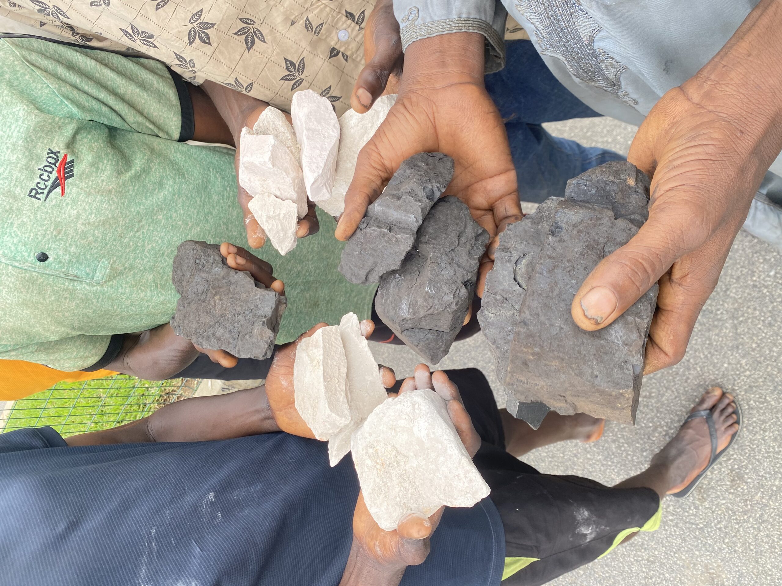 EFCC operatives arrest 13 suspected illegal miners with five trucks loaded with tons of coal and kaolin in Asokoro area of Abuja.