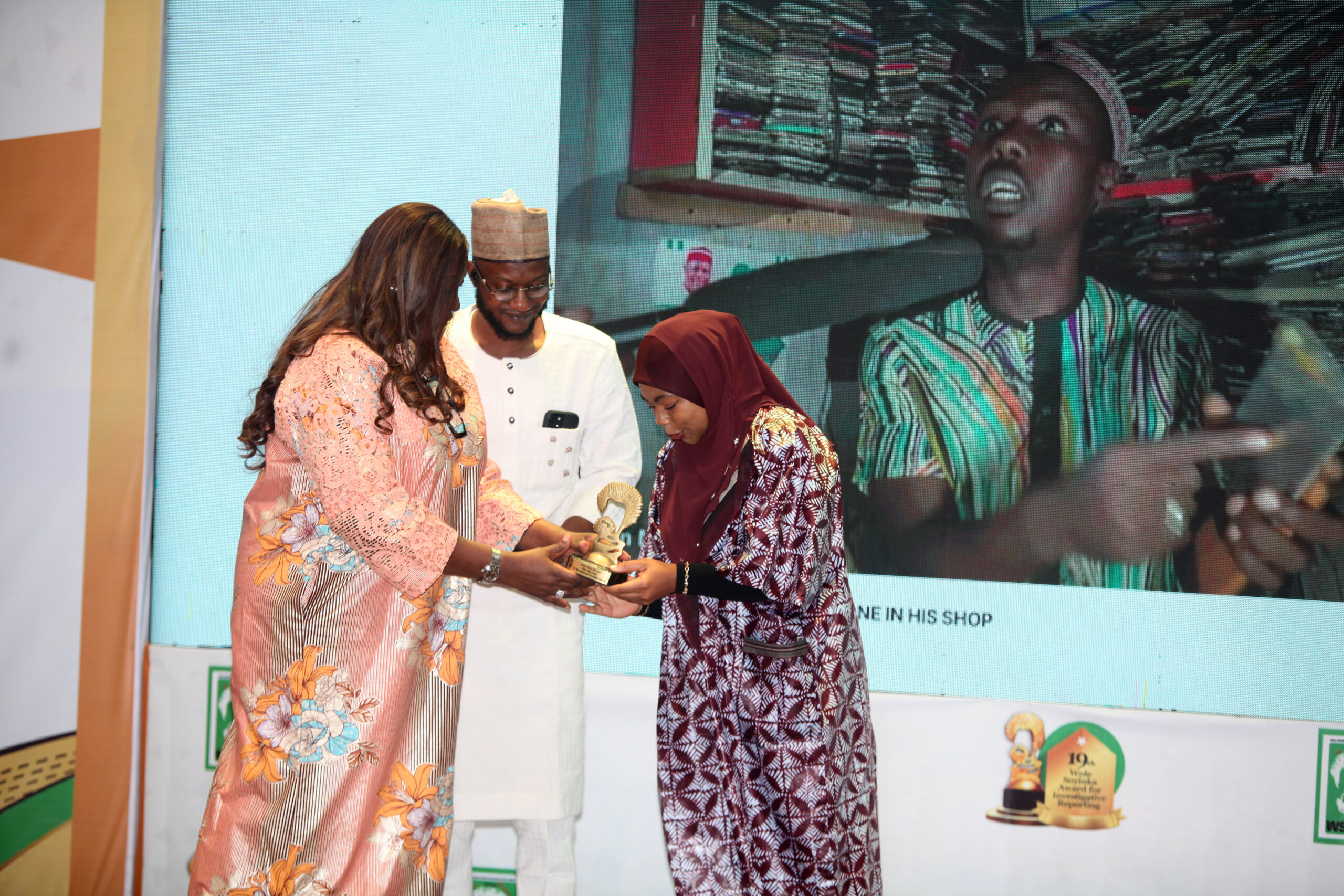 Stella Din Jacob, Editor-in-Chief and News Director, TVCNews, and Chair, 2024 Judges Board, Wole Soyinka Award for Investigative Reporting (WSAIR) (left), presents award to Jemilat Nasiru.