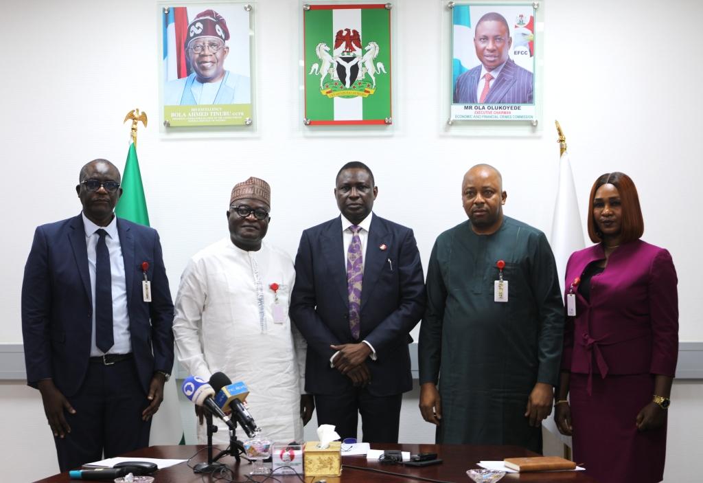 EFCC hands over four title documents of four plots of land worth over N1 billion recovered from criminal syndicates in Abuja to their owners.