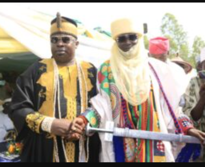 The Aholu of Kweme kingdom, Oba Sejiro James presenting staff of office to the new Seriki Fulani of Badagry, Alhaji Mohammed Umar.
