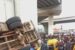 A driver was injured as his fully-laden truck plunged down Pen Cinema Bridge in Lagos and landed on two buses early Saturday morning.