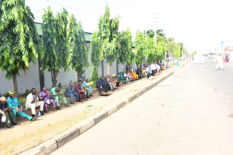 APC delegates and loyalists waiting to be screened into the venue of the election