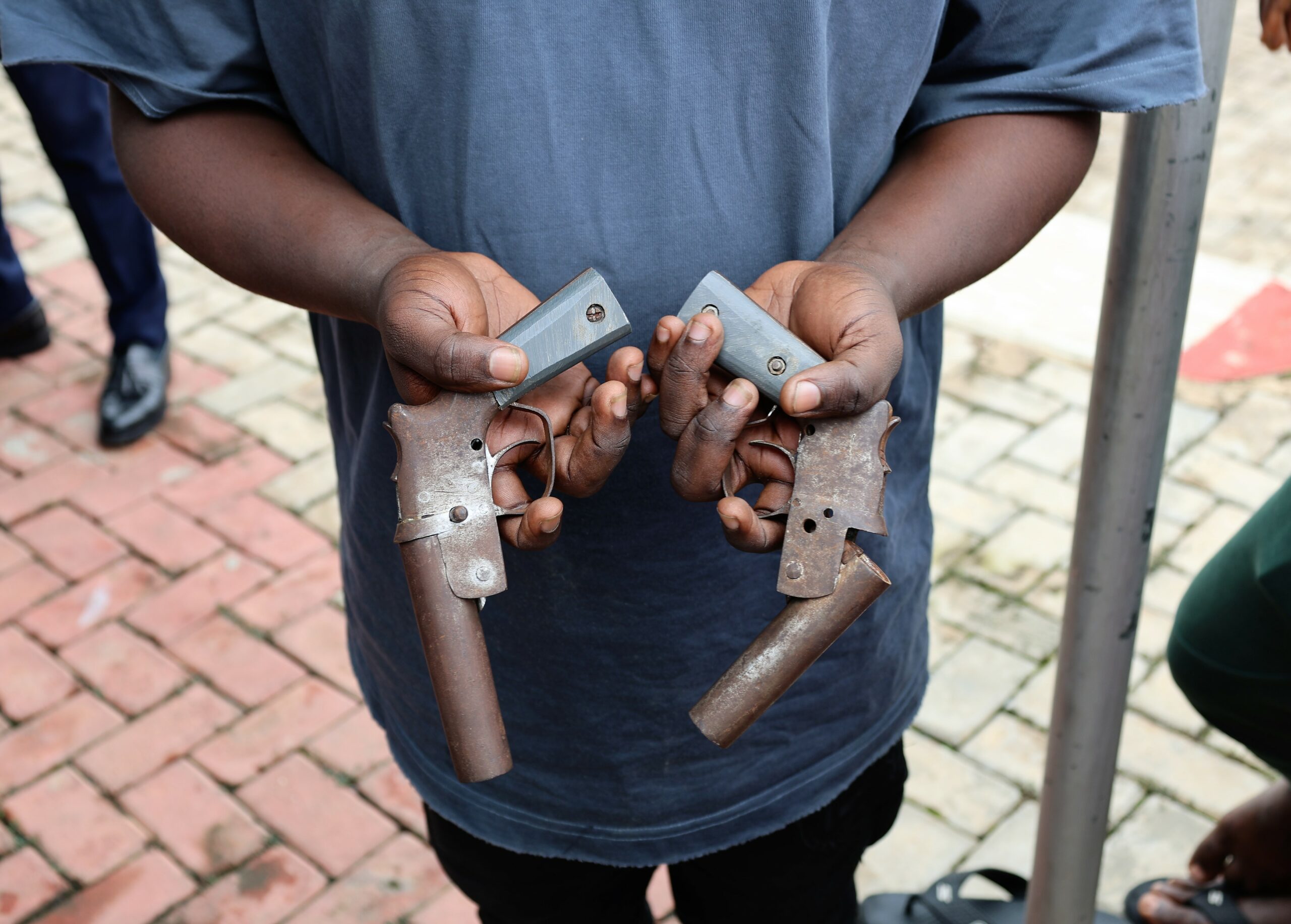 EFCC lists two guns among items recovered from 55 suspected internet fraudsters arrested at K Hotel in Itori, Ewekoro area of Ogun State