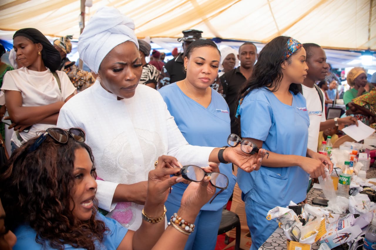 Prophetess Funmilola Lucas with some beneficiaries of the empowerment programme