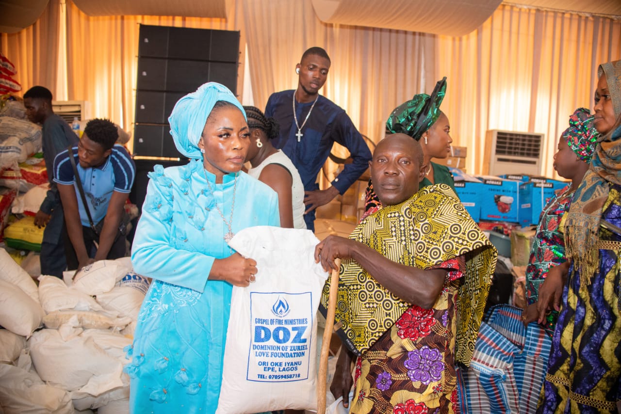Prophetess Funmilola Lucas with some beneficiaries of the empowerment programme