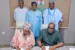 The Executive Secretary of the Solid Minerals Development Fund, Hajiya Fatima Shinkafi (left) and Franklin Edochie, the Deputy Director of the Africa Finance Corporation and Head, Metals and Mining signing an investment partnership agreement to jointly fund three projects including a 1.3 billion dollars alumina project recently with the Minister of Solid Minerals Development, Dele Alake (middle behind) witnessing the event