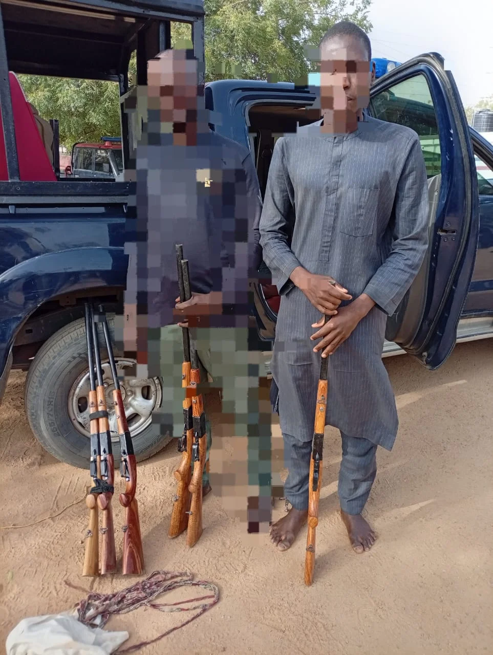 NSCDC operatives nab alleged gunrunner Suleiman M. Uba with six firearms along Murtala Muhammad Way, Kano State.