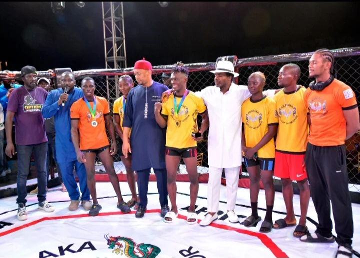 Fighters alongside Ebere Benard, president of Akalaka, Idowu Olusareyo, CEO of Option A International, and Abubakar Marwa of Marwa Self Defence, after the fight night in Abuja on Sunday
