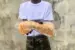Police operatives recover pistol hidden in a loaf of bread by a vehicle passenger identified as Braya Nanas in Port Harcourt, Rivers State